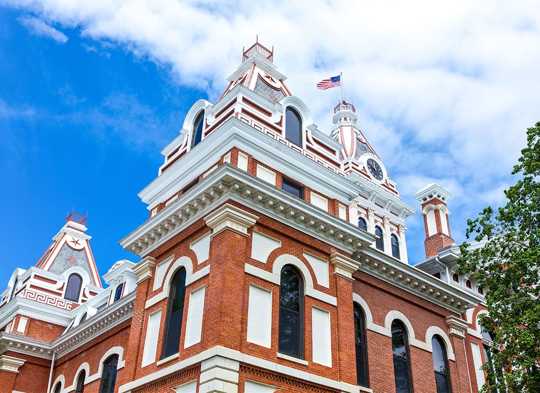 Pontiac, IL - Historical Brick Courthouse in Downtown Pontiac Illinois Against a Cloudy Blue Sky